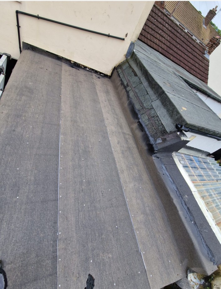 Installing warm roof insulation boards for energy efficiency and added 1st layer of felt in Canterbury