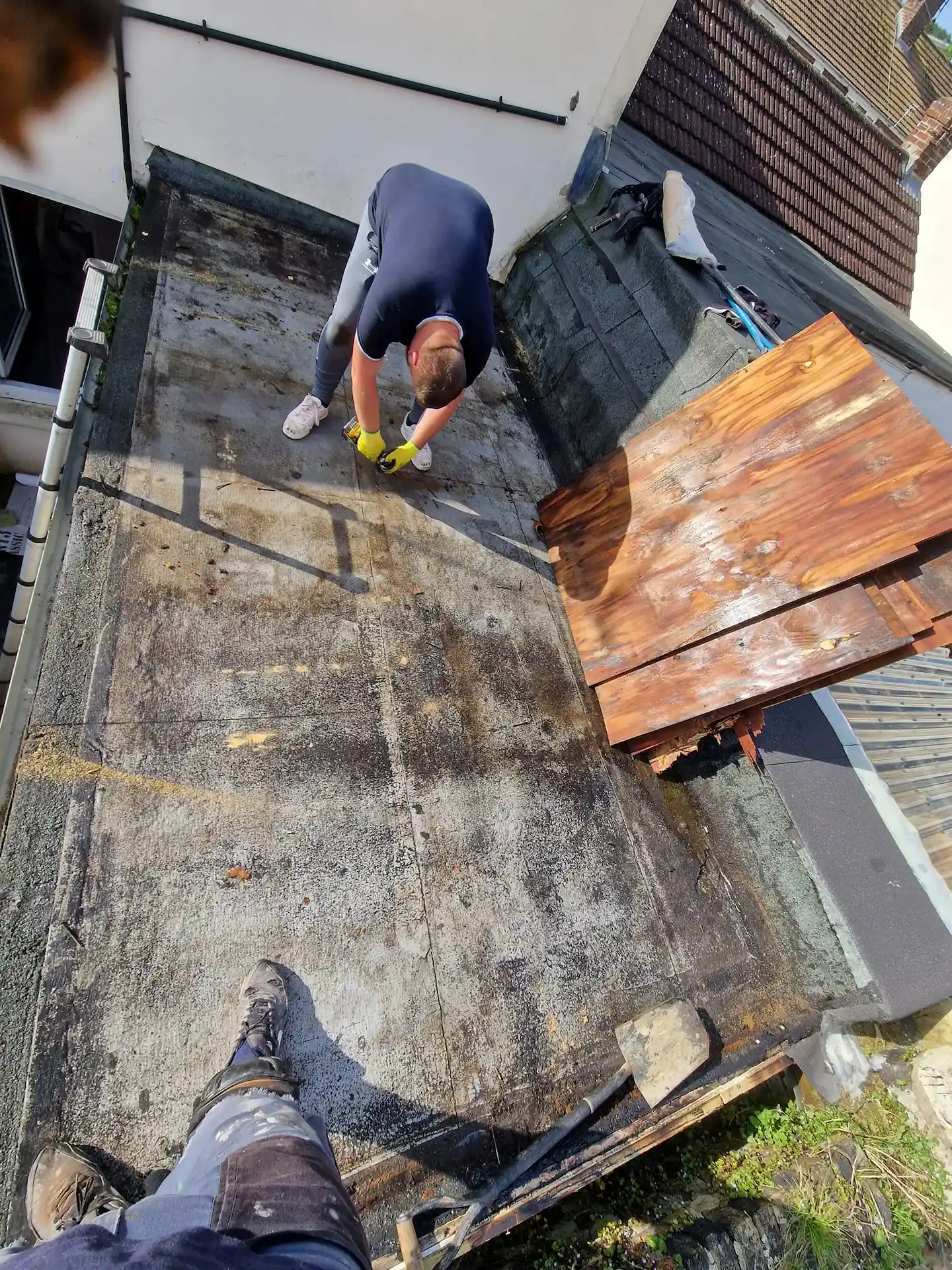 Flat roof stripped back showing timber deck in Canterbury